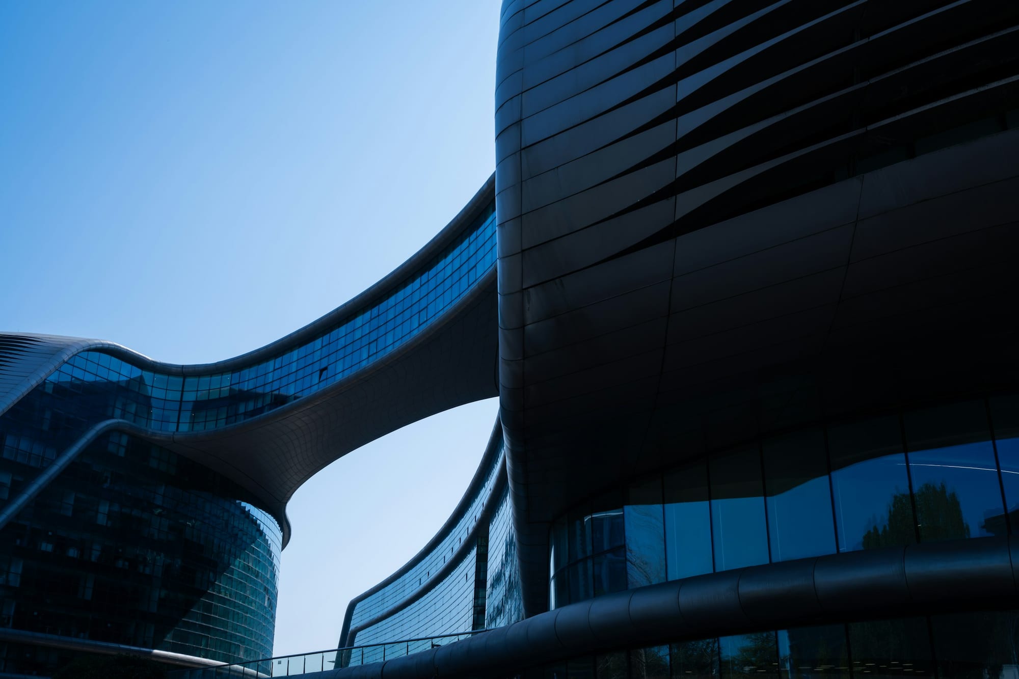 Modern architectural buildings with curved glass facades